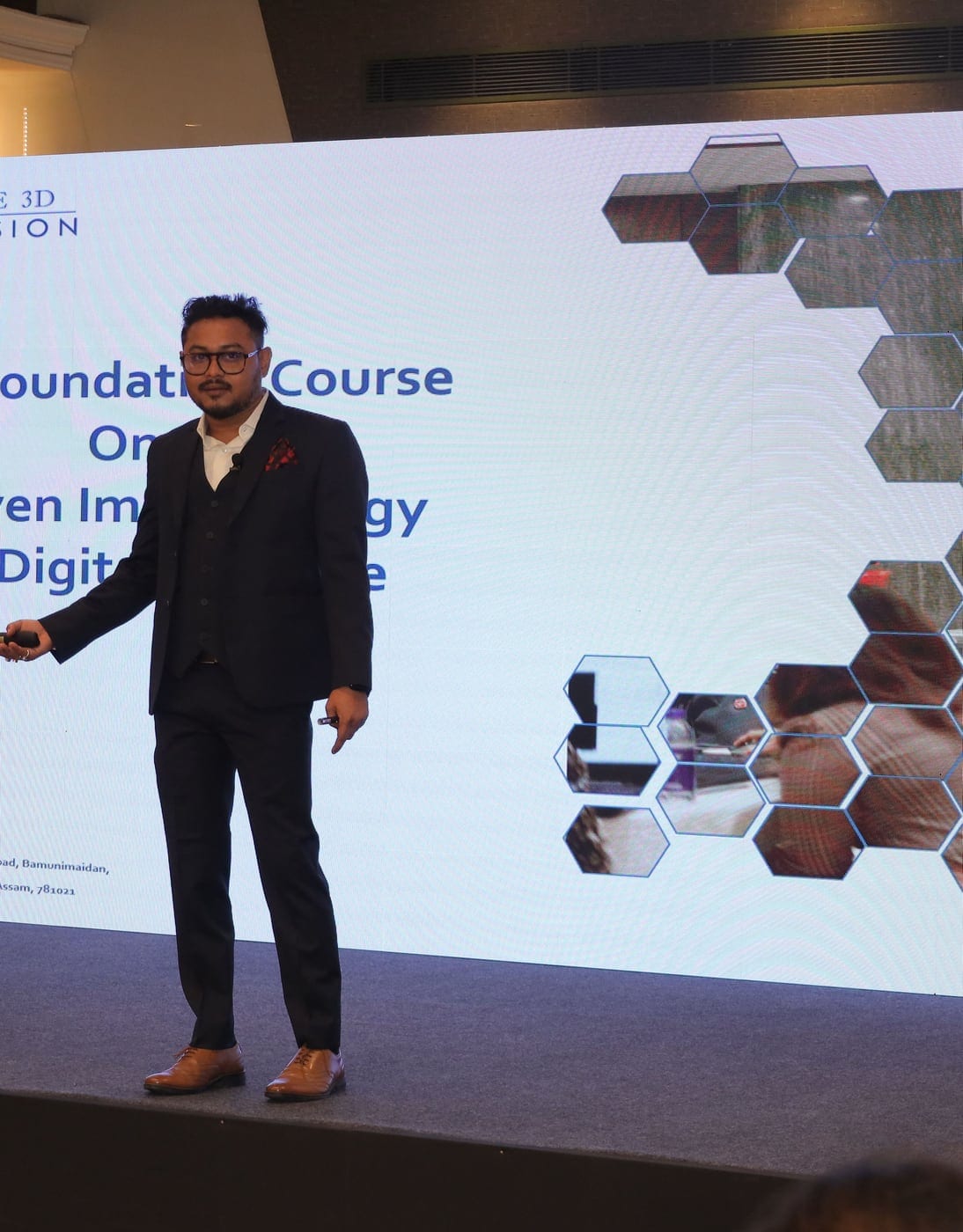 Sudeep Paul on stage presenting an AI-driven implantology foundation course